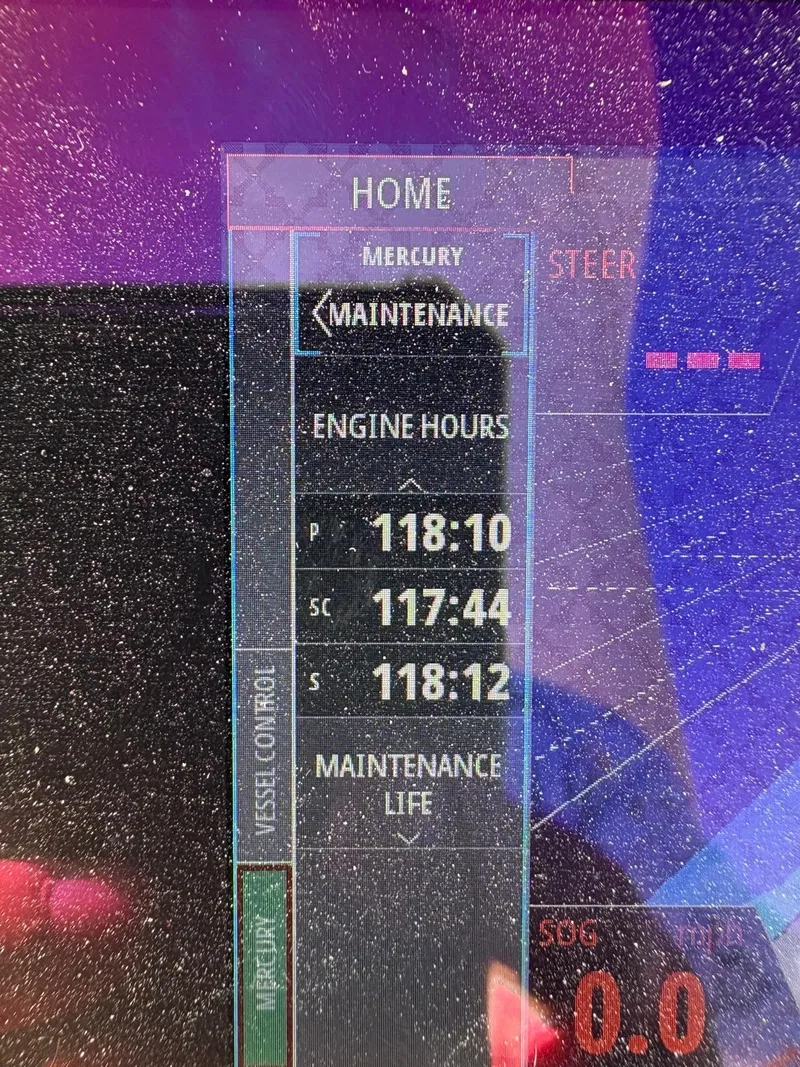 Slide: The Image of Display screen showing engine hours for a 2022 Monterey 385 Super Express boat. - 3