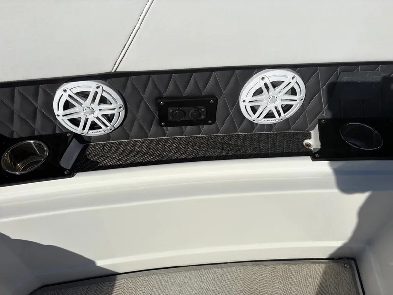 Slide: The Image of 2022 Monterey 385 Super Express boat interior with speakers and control panel. - 7