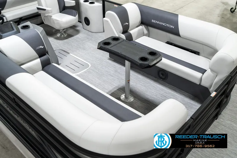 Slide: The Image of 2025 Bennington 22 SSB pontoon boat interior with plush seating and table. - 13