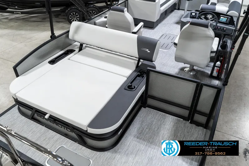Slide: The Image of 2025 Bennington 22 SSB pontoon boat interior with plush seating and modern dashboard. - 14