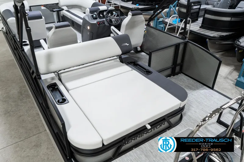 Slide: The Image of 2025 Bennington 22 SSB pontoon boat interior with plush seating and modern controls. - 15