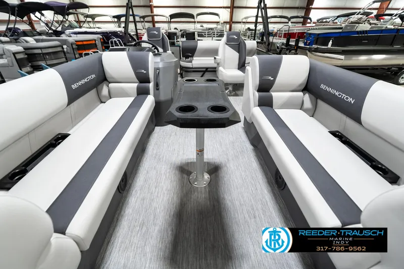 Slide: The Image of 2025 Bennington 22 SSB pontoon boat interior with gray seating and central table. - 16