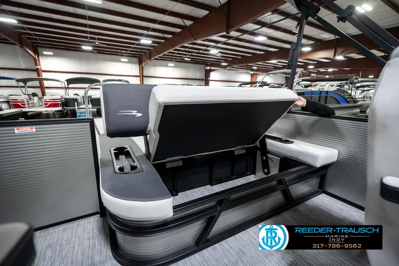 Slide: The Image of 2025 Bennington 22 SSB pontoon boat interior with open storage compartment. - 29