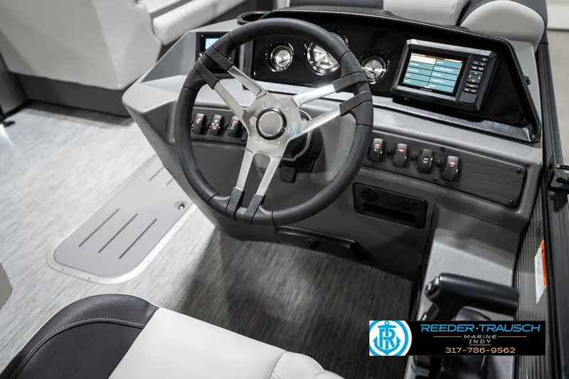 Slide: The Image of 2025 Bennington 22 SSB boat dashboard with steering wheel and control panel. - 30