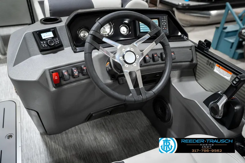 Slide: The Image of 2025 Bennington 22 SSB boat dashboard with steering wheel and control panel. - 31
