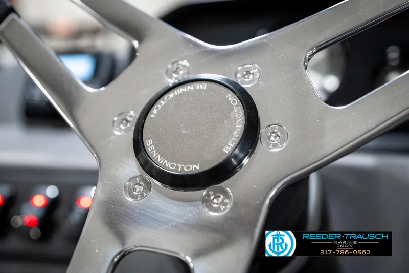 Slide: The Image of Steering wheel of 2025 Bennington 22 SSB boat, featuring sleek metallic design. - 32