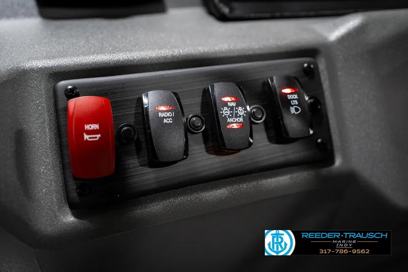 Slide: The Image of Control panel of 2025 Bennington 22 SSB boat with labeled switches. - 33