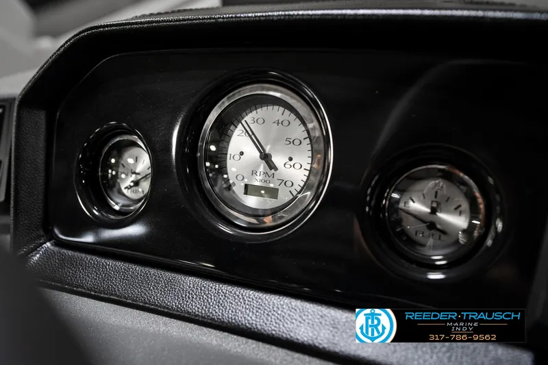 Slide: The Image of Dashboard gauges of a 2025 Bennington 22 SSB boat, featuring RPM and other indicators. - 35