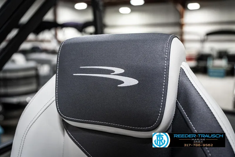 Slide: The Image of 2025 Bennington 22 SSB boat seat with logo, featuring sleek black and white design. - 40