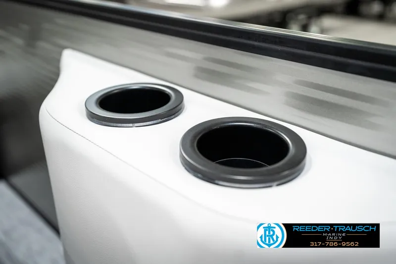 Slide: The Image of 2025 Bennington 22 SSB boat cup holders, sleek design, Reeder-Trausch branding. - 42
