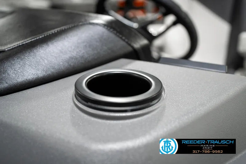 Slide: The Image of Cup holder on 2025 Bennington 22 SSB boat console, featuring sleek design and leather accents. - 43