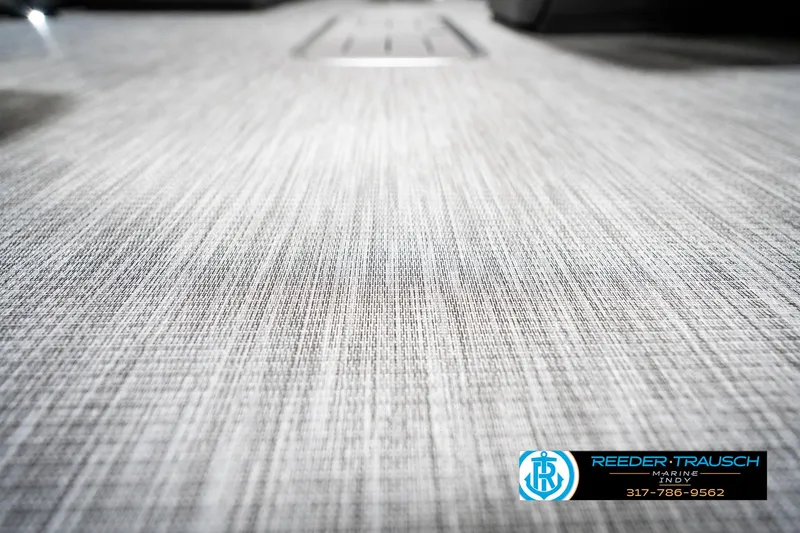 Slide: The Image of 2025 Bennington 22 SSB boat flooring with textured surface, featuring Reeder-Trausch branding. - 44