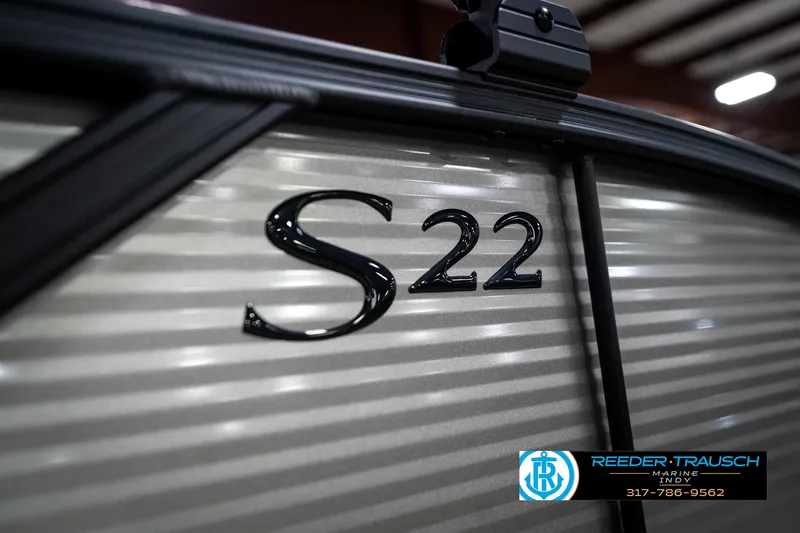 Slide: The Image of 2025 Bennington 22 SSB boat with "S 22" emblem, Reeder-Trausch logo visible. - 48