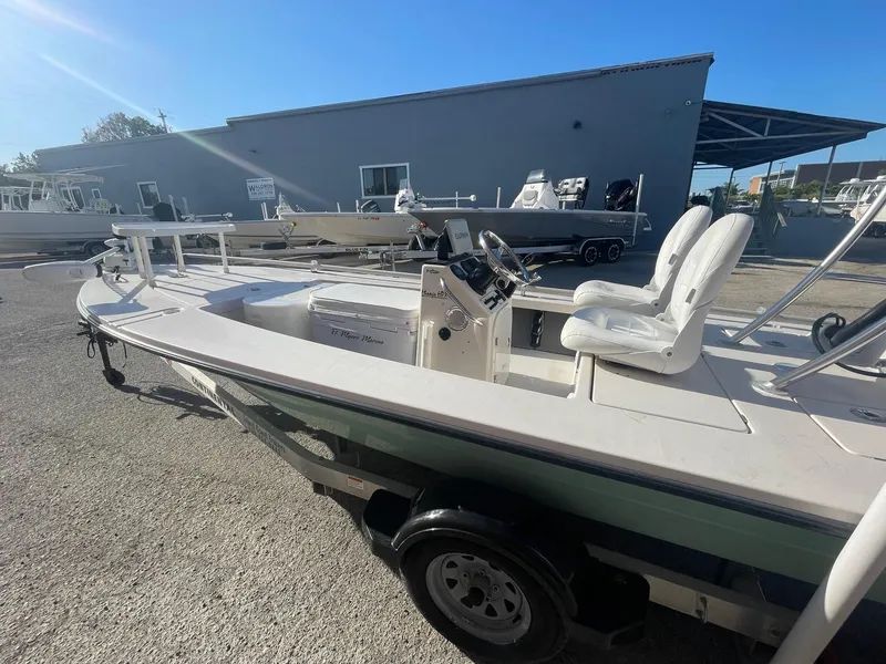 Slide: The Image of 2006 Maverick Mirage 17HPX-Tunnel boat on trailer, parked outdoors under clear blue sky. - 12