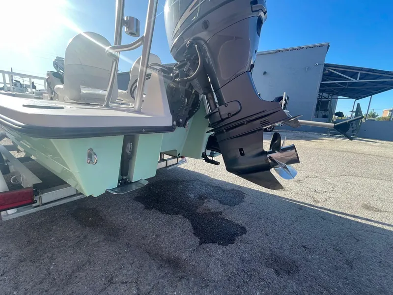 Slide: The Image of 2006 Maverick Mirage 17HPX-Tunnel boat with outboard motor, parked on pavement. - 13