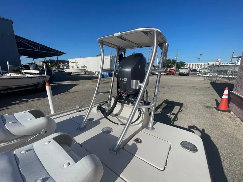 Slide: The Image of 2006 Maverick Mirage 17HPX-Tunnel boat with outboard motor in a parking lot. - 15