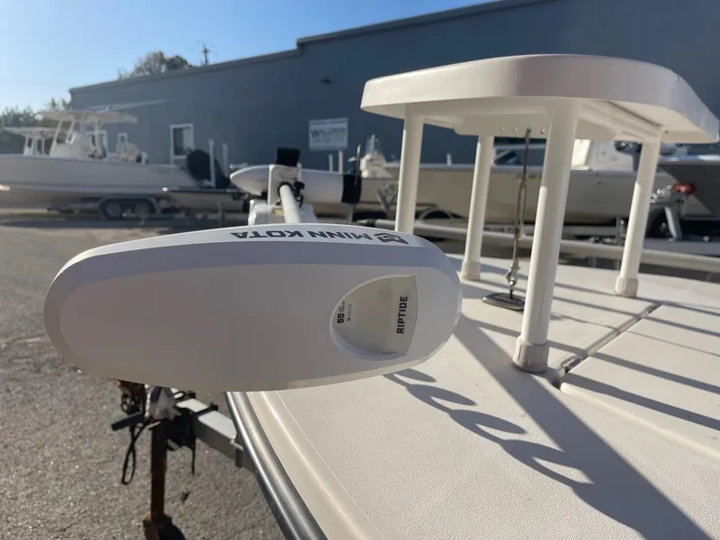 Slide: The Image of 2006 Maverick Mirage 17HPX-Tunnel boat with Minn Kota trolling motor in a sunny outdoor setting. - 2