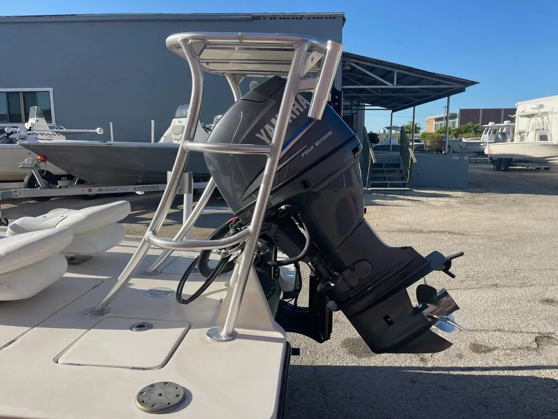 Slide: The Image of 2006 Maverick Mirage 17HPX-Tunnel boat with Yamaha outboard motor in a marina setting. - 5