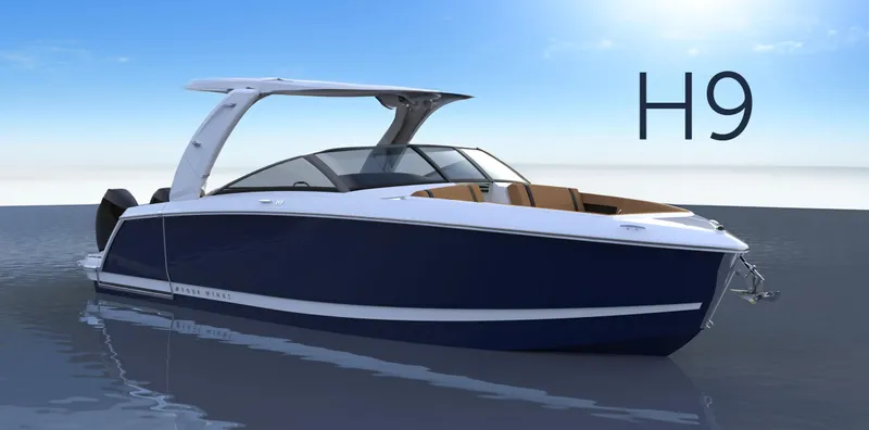Slide: The Image of 2025 Four Winns H9C boat on calm water, sleek design, blue and white exterior. - 8