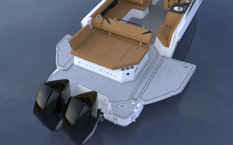 Slide: The Image of 2025 Four Winns H9C boat with dual engines and spacious seating on calm water. - 9