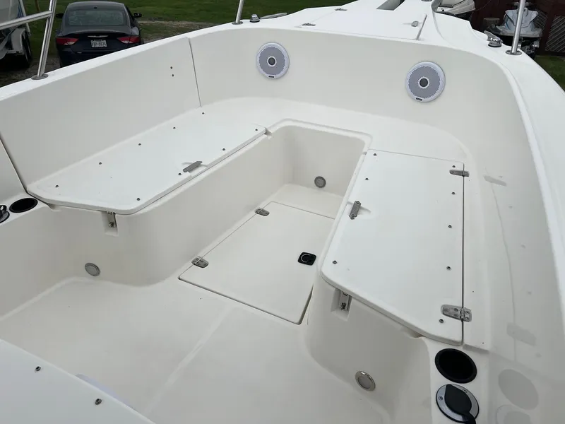 Slide: The Image of 1998 Boston Whaler 26 Outrage boat interior with storage compartments and speakers. - 14