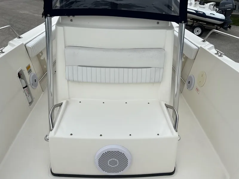 Slide: The Image of 1998 Boston Whaler 26 Outrage boat interior with seating and speaker. - 15