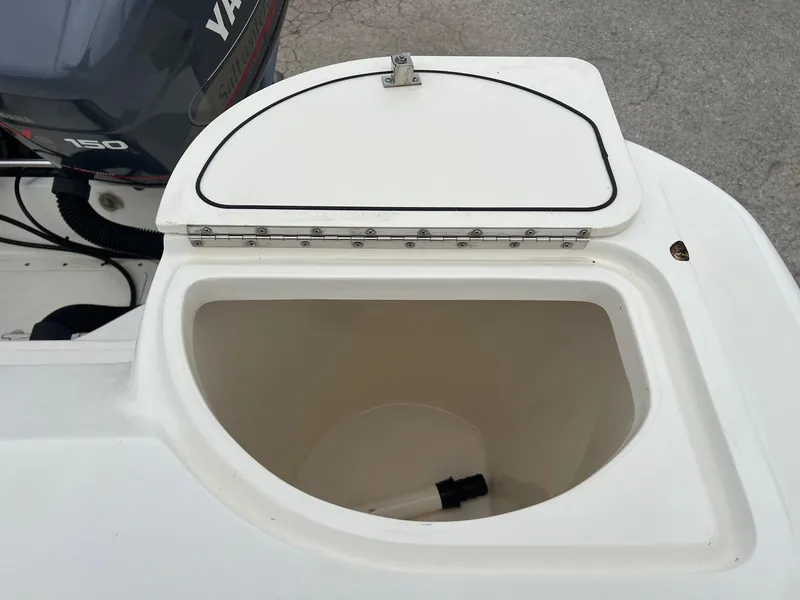 Slide: The Image of Open storage compartment on a 1998 Boston Whaler 26 Outrage boat. - 18