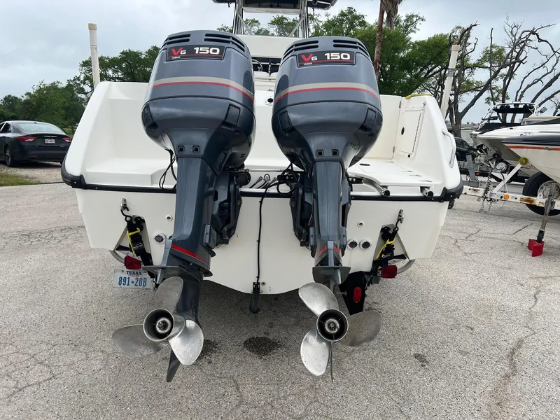 Slide: The Image of 1998 Boston Whaler 26 Outrage with twin V6 150 outboard engines, rear view. - 2