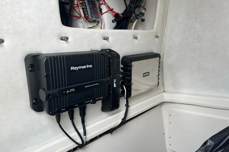 Slide: The Image of Electronics setup in a 1998 Boston Whaler 26 Outrage boat interior. - 28