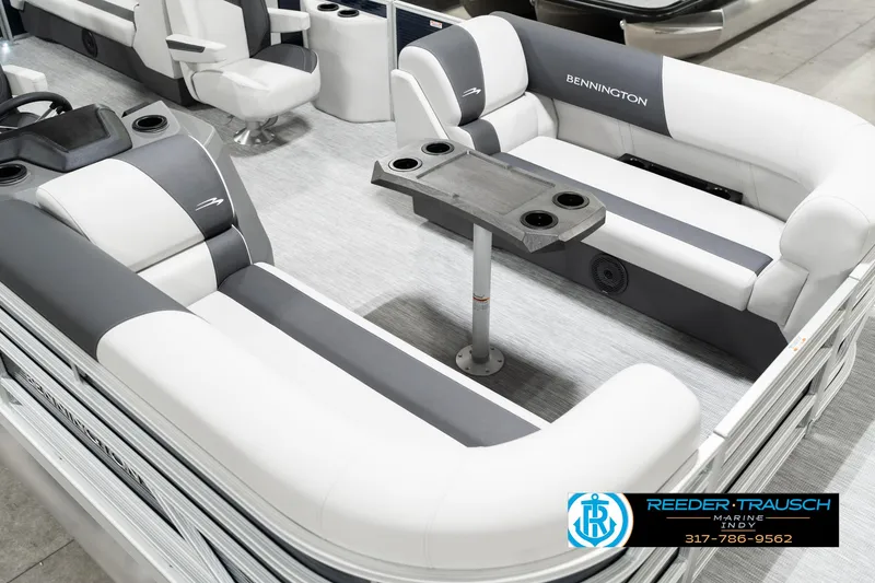 Slide: The Image of 2025 Bennington 22 SSR pontoon boat interior with gray and white seating and table. - 13