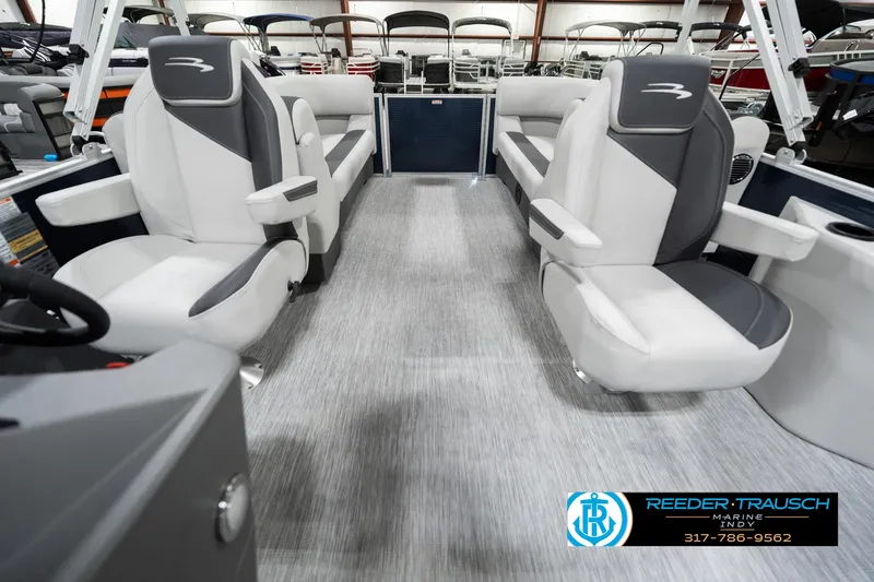 Slide: The Image of 2025 Bennington 22 SSR boat interior with gray seating and modern design. - 17