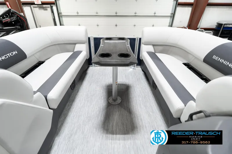 Slide: The Image of 2025 Bennington 22 SSR boat interior with gray seating and central table. - 21