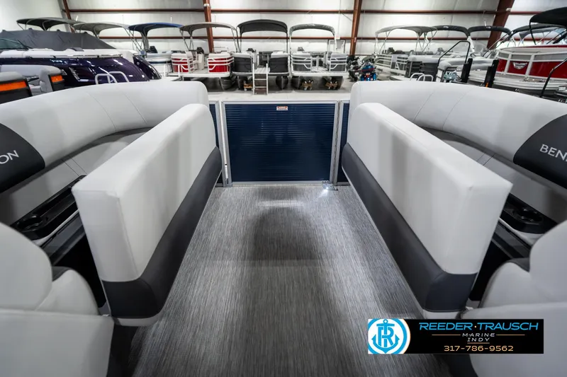 Slide: The Image of 2025 Bennington 22 SSR pontoon boat interior with gray seating and carpet flooring. - 27