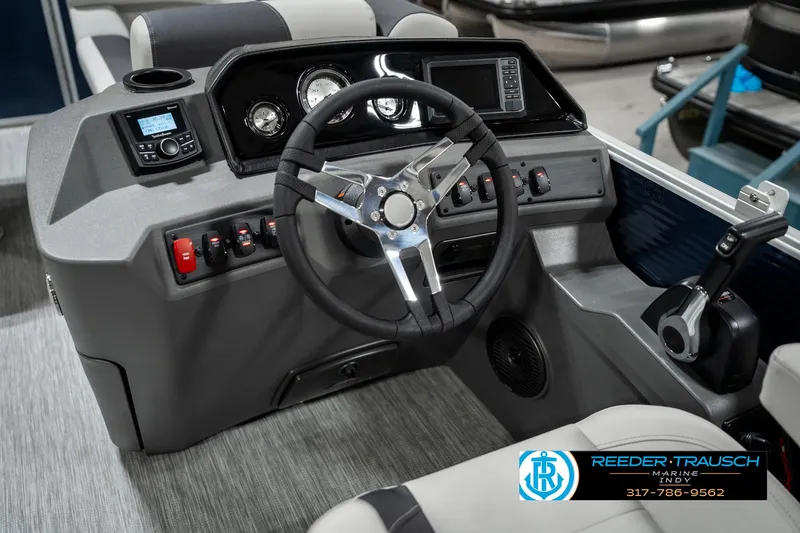 Slide: The Image of 2025 Bennington 22 SSR boat dashboard with steering wheel and control panel. - 29