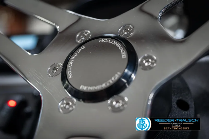 Slide: The Image of Close-up of 2025 Bennington 22 SSR steering wheel with logo detail. - 30