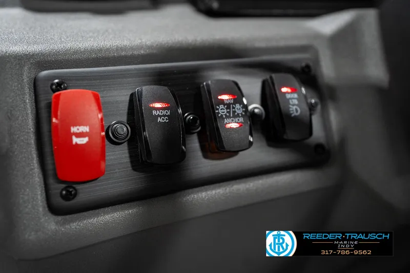 Slide: The Image of Control panel of 2025 Bennington 22 SSR boat with labeled switches. - 31