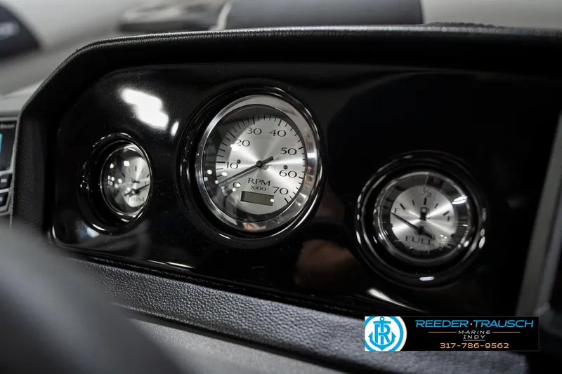 Slide: The Image of Dashboard gauges of 2025 Bennington 22 SSR boat, featuring RPM and fuel indicators. - 33
