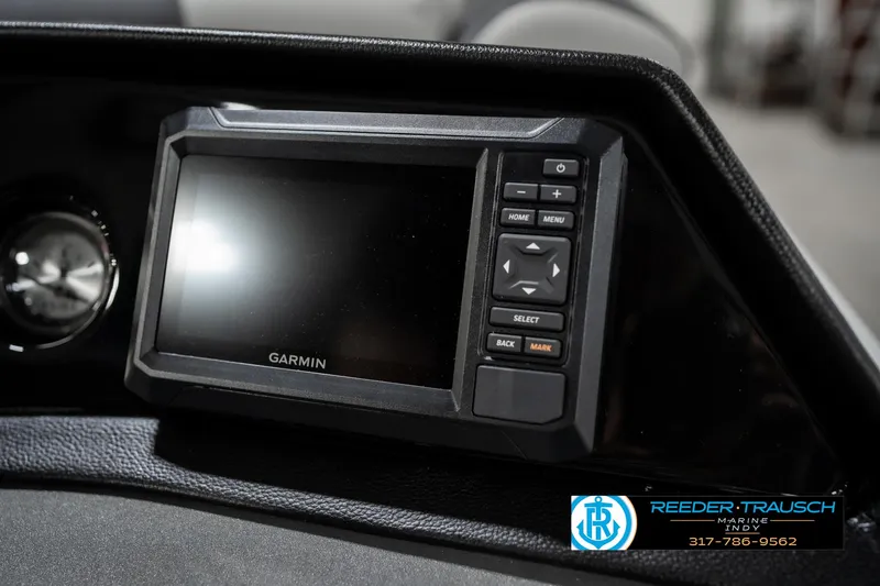 Slide: The Image of Garmin display on 2025 Bennington 22 SSR boat dashboard, featuring control buttons. - 34