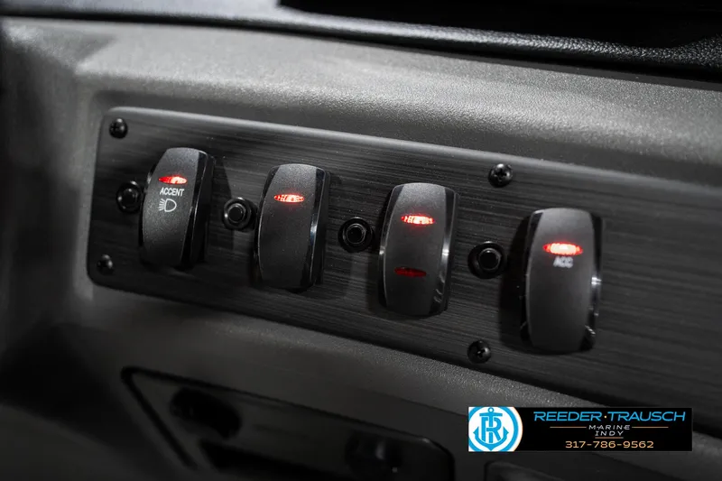 Slide: The Image of Control panel of 2025 Bennington 22 SSR boat with illuminated switches. - 35