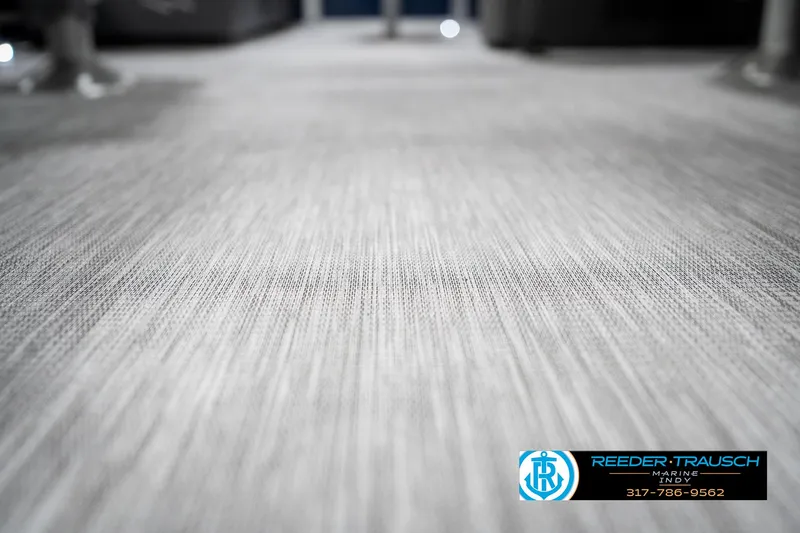 Slide: The Image of Carpet texture on 2025 Bennington 22 SSR boat floor, featuring Reeder-Trausch branding. - 41