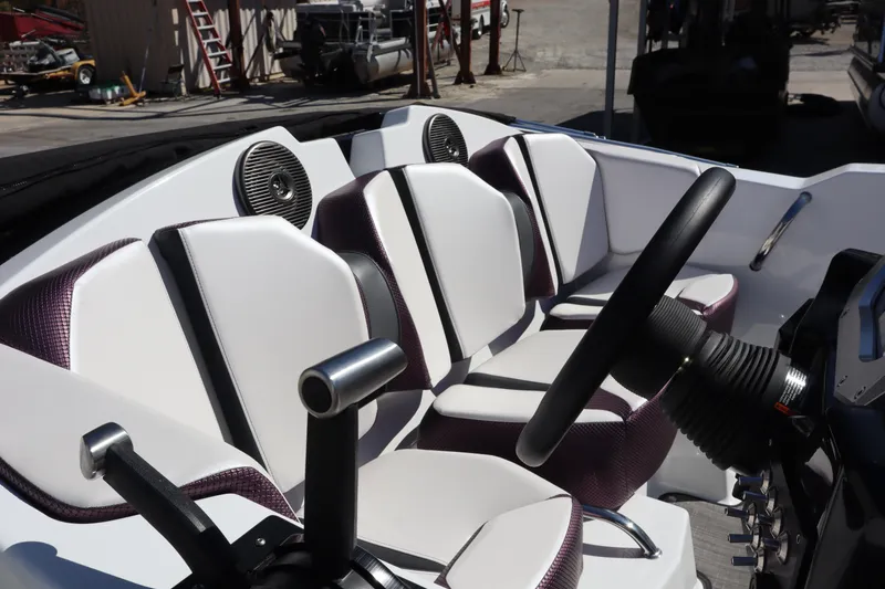 Slide: The Image of Interior of 2023 Scarab 165 ID boat with modern seating and steering wheel. - 11