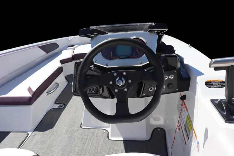 Slide: The Image of 2023 Scarab 165 ID boat interior with steering wheel and dashboard. - 6