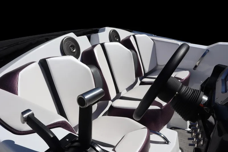 Slide: The Image of 2023 Scarab 165 ID boat interior with modern seating and steering wheel. - 7