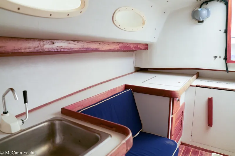 Slide: The Image of Interior of 2002 Alerion Express 28 yacht with sink, seating, and storage. - 17