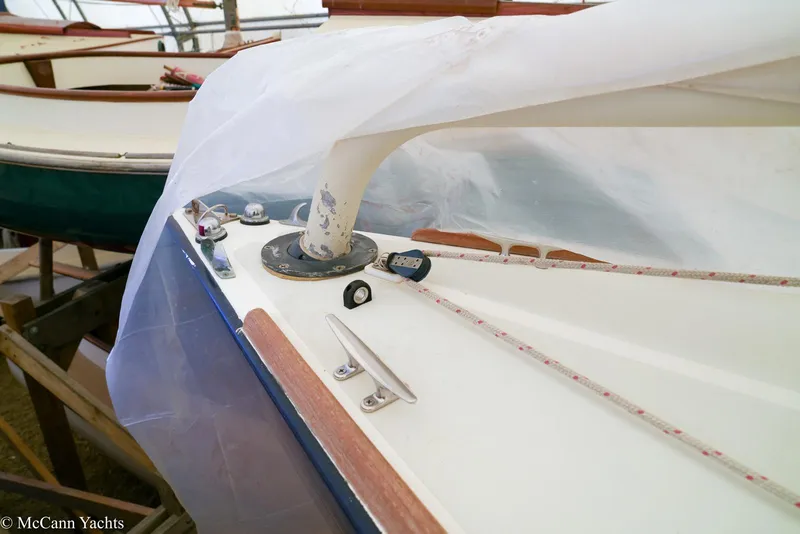 Slide: The Image of 2002 Alerion Express 28 sailboat deck with rigging details and protective cover. - 21