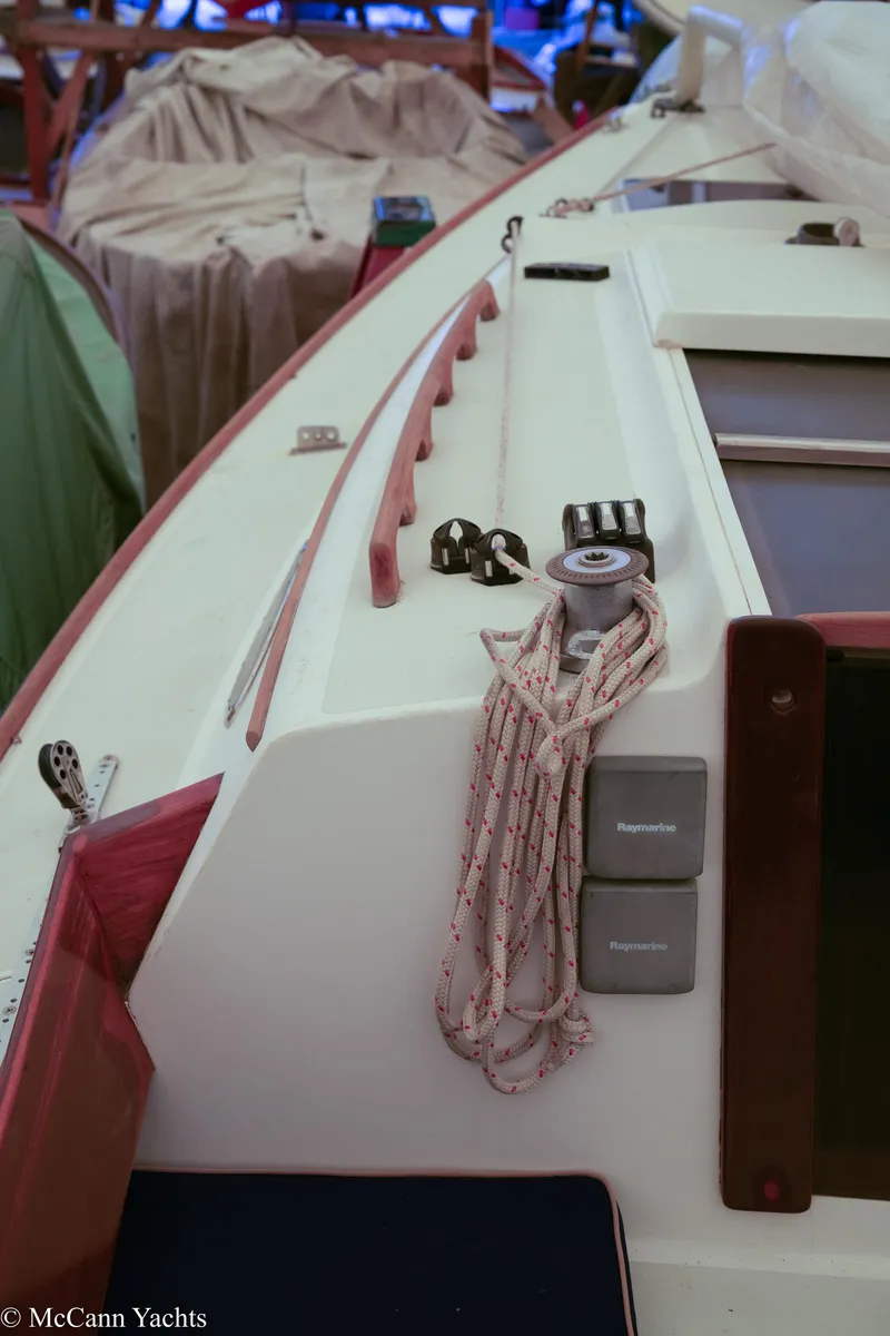 Slide: The Image of 2002 Alerion Express 28 sailboat deck with ropes and winch. - 26