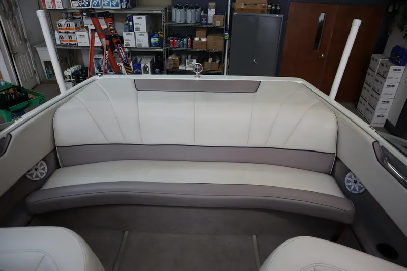 Slide: The Image of Interior of a 1996 Cobalt 220 boat with white and gray seating. - 10