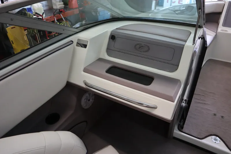 Slide: The Image of Interior of a 1996 Cobalt 220 boat, featuring sleek dashboard and seating. - 13