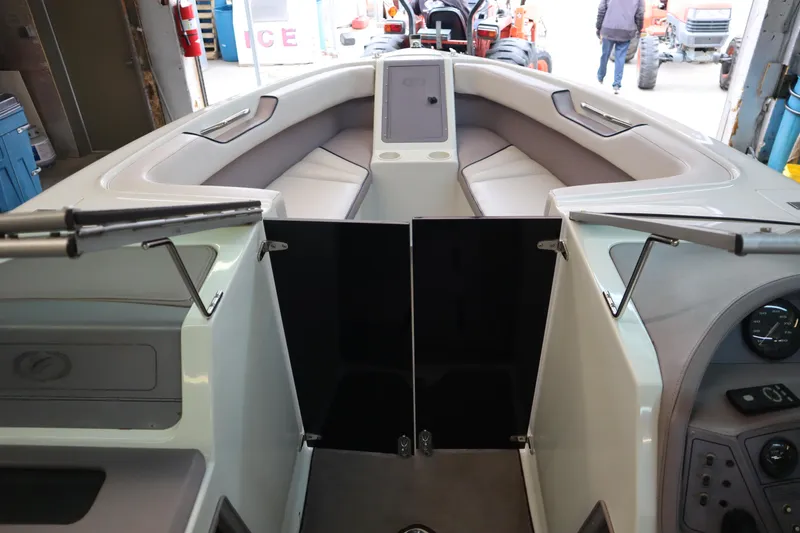 Slide: The Image of Interior view of a 1996 Cobalt 220 boat with cushioned seating. - 16
