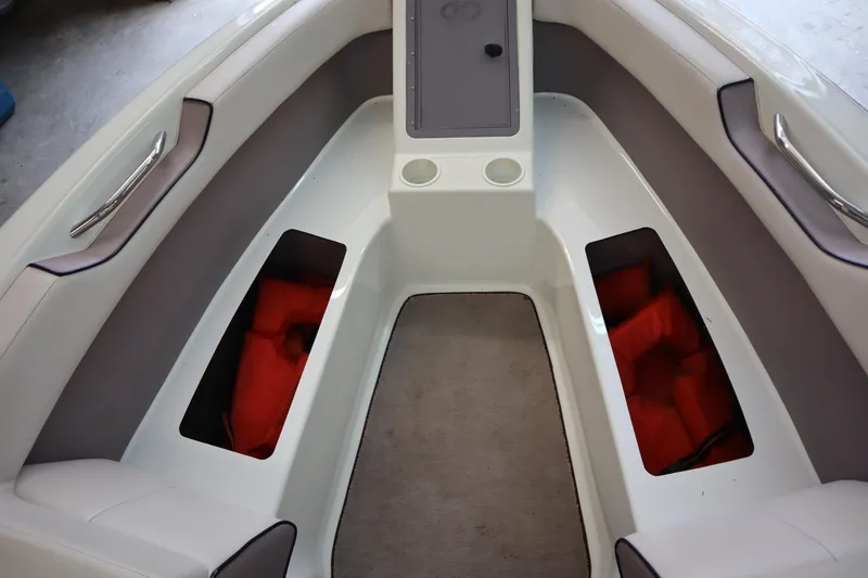 Slide: The Image of Interior of a 1996 Cobalt 220 boat with storage compartments and seating. - 17
